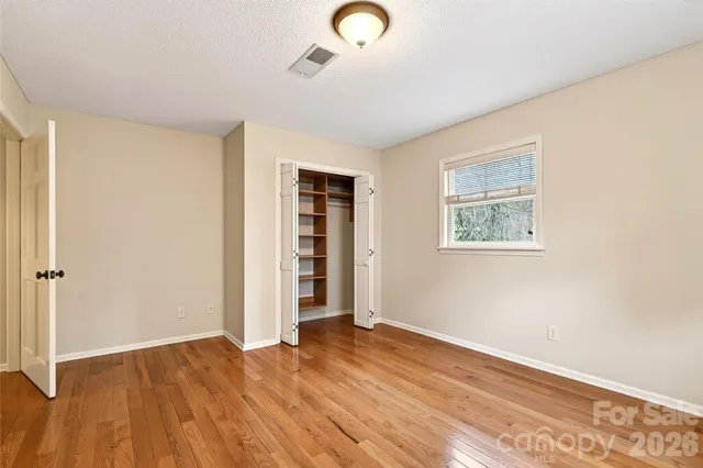 a bathroom with a double vanity sink mirror and shower