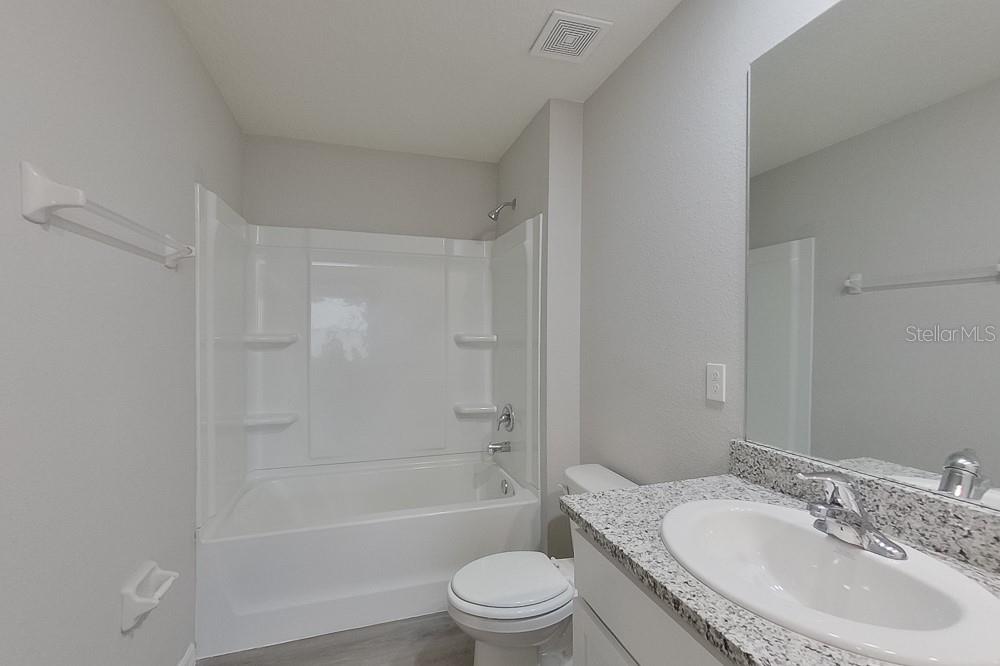 4397 Southwest 85th Lane Ocala, FL 34476 - Photo 16 of 23 a bathroom with a sink toilet and shower