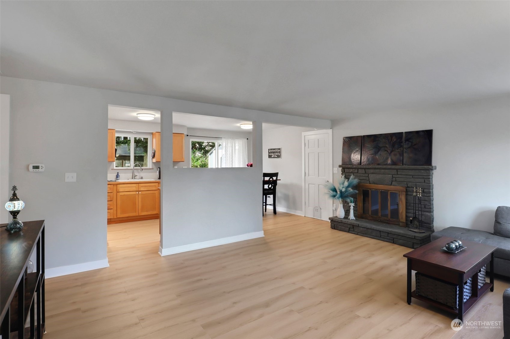 11504 Southeast 178th Place Renton, WA 98055 - Photo 15 of 30 a living room with furniture and a fireplace