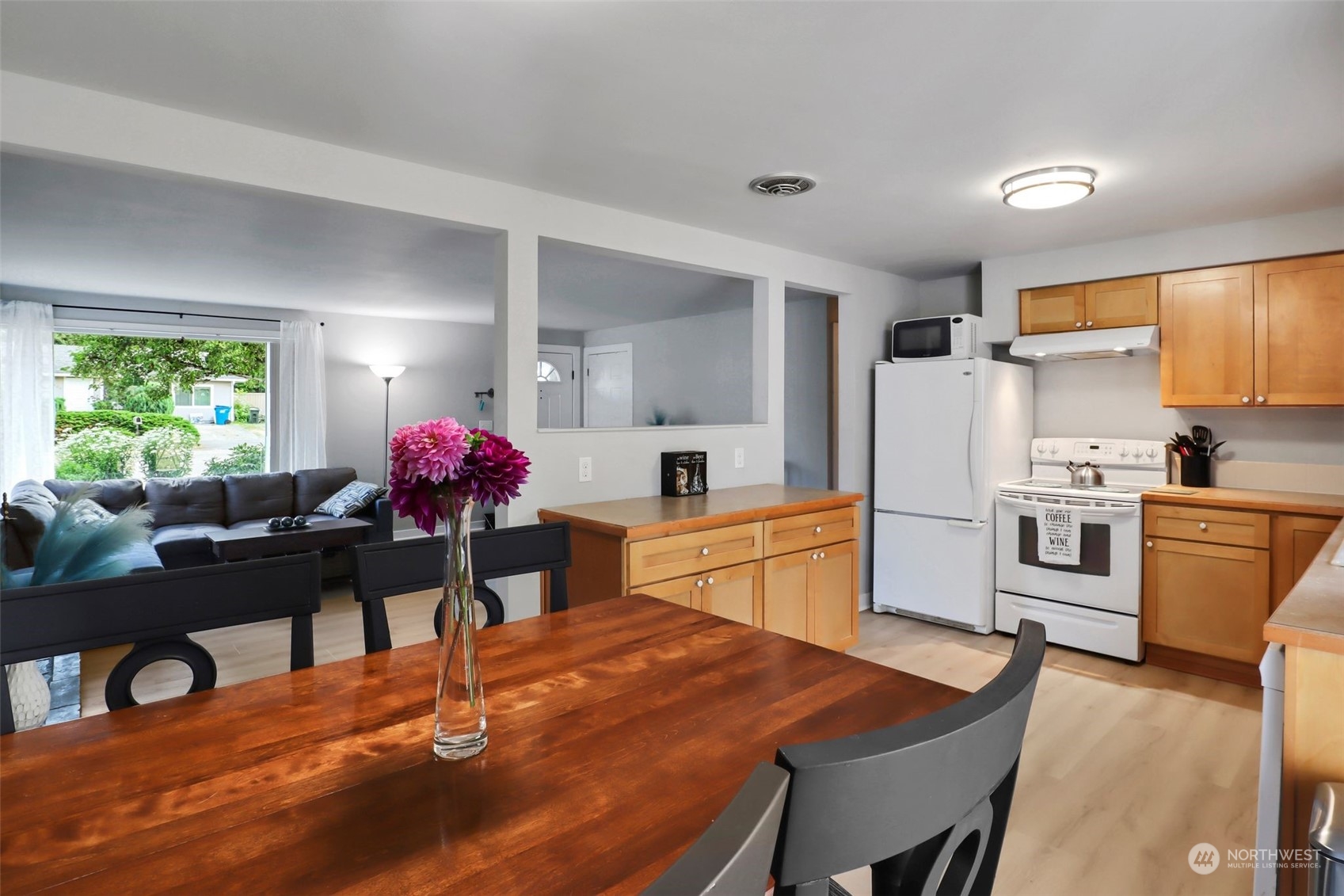 11504 Southeast 178th Place Renton, WA 98055 - Photo 18 of 30 a kitchen with white cabinets and refrigerator