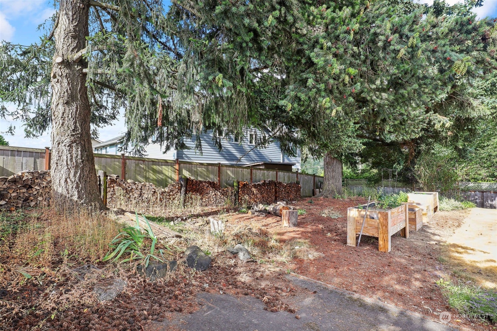 11504 Southeast 178th Place Renton, WA 98055 - Photo 6 of 30 a white bench sitting in a backyard of a house