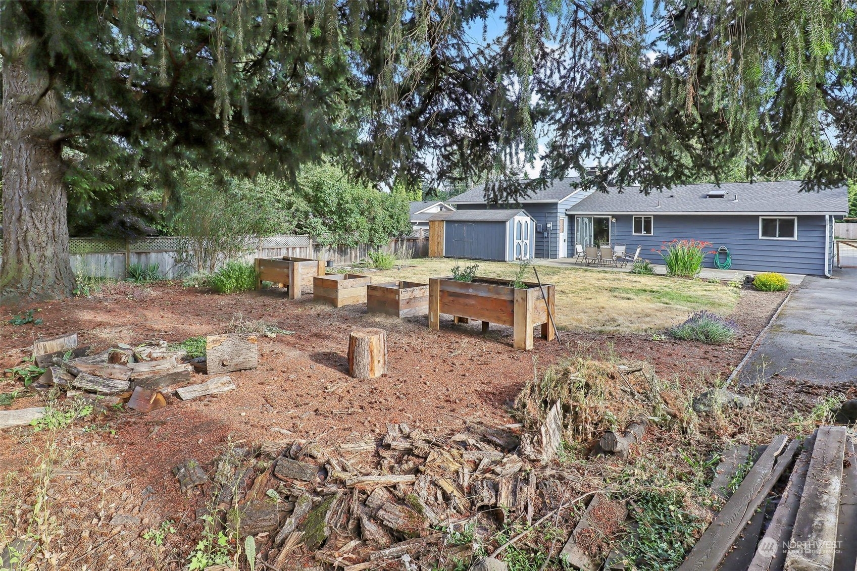 11504 Southeast 178th Place Renton, WA 98055 - Photo 7 of 30 a backyard of a house with barbeque oven table and chairs