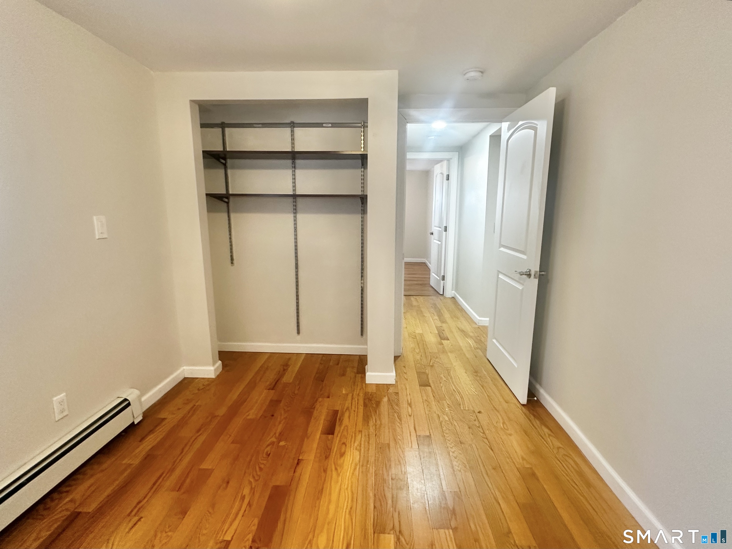 49 Pleasant Street Ansonia, CT 06401 - Photo 11 of 17 a view of wooden floor in an empty room
