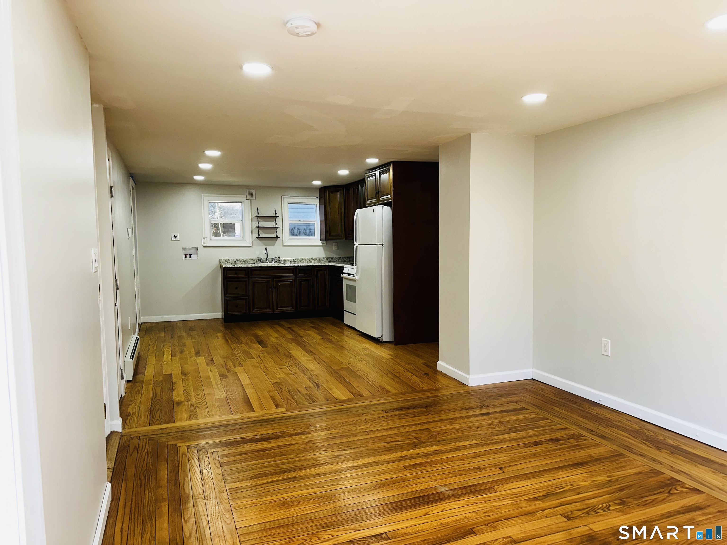 49 Pleasant Street Ansonia, CT 06401 - Photo 4 of 17 a view of kitchen and utility room