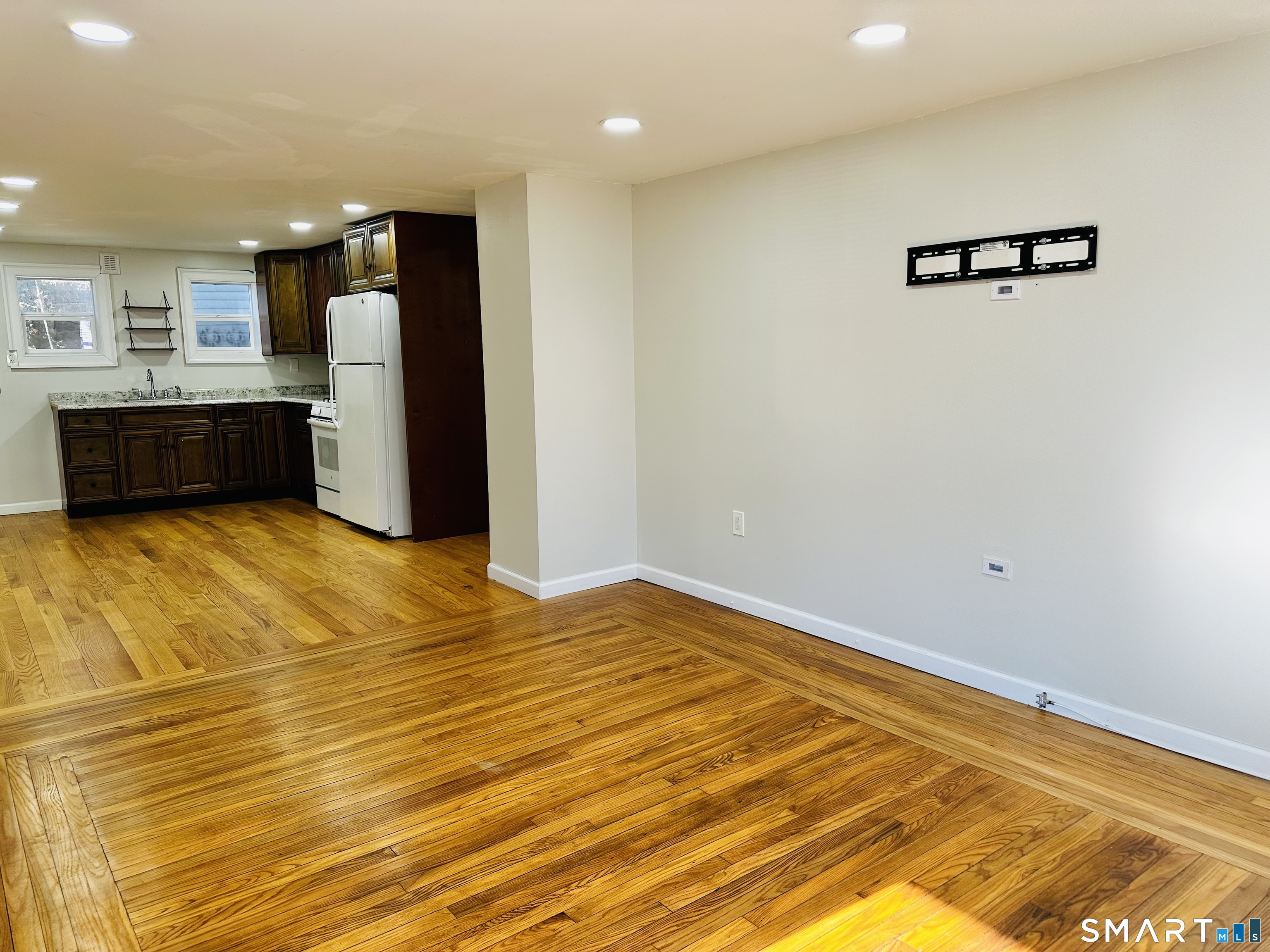49 Pleasant Street Ansonia, CT 06401 - Photo 5 of 17 a view of kitchen with refrigerator and cabinets