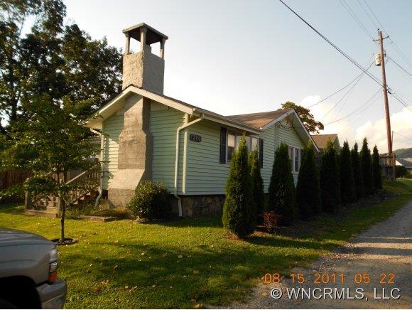 200 Pigeon Road Canton, NC 28716 - Photo 1 of 17 a view of a house with backyard and trees