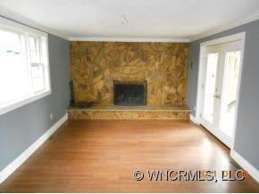 200 Pigeon Road Canton, NC 28716 - Photo 3 of 17 a view of an empty room with a window