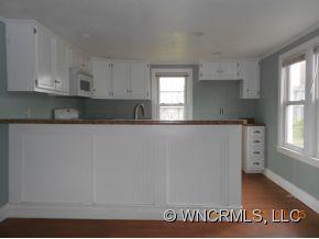 200 Pigeon Road Canton, NC 28716 - Photo 5 of 17 a kitchen with granite countertop a sink and a stove