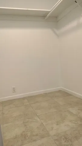 a bathroom with a toilet and a cabinets