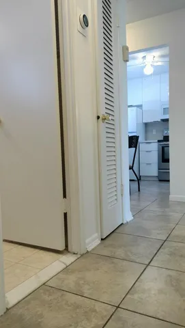 a stove top oven sitting inside of a kitchen