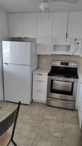 a view of storage and utility room with racks on the wall