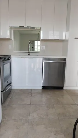 a view of a house with backyard and tree s