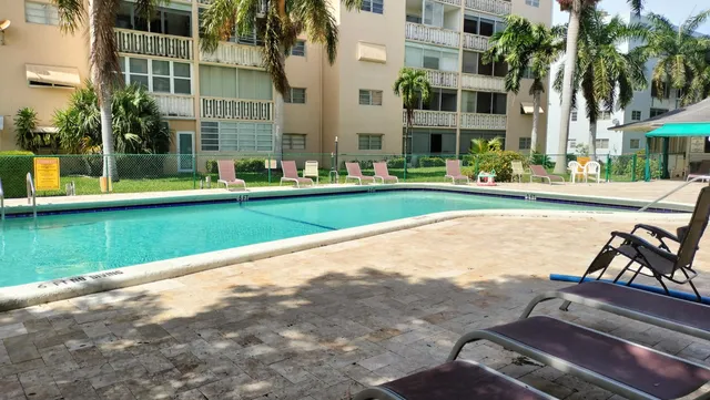 a view of a park with trees and plants
