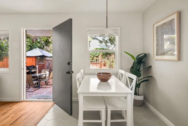 a dining room with furniture and window