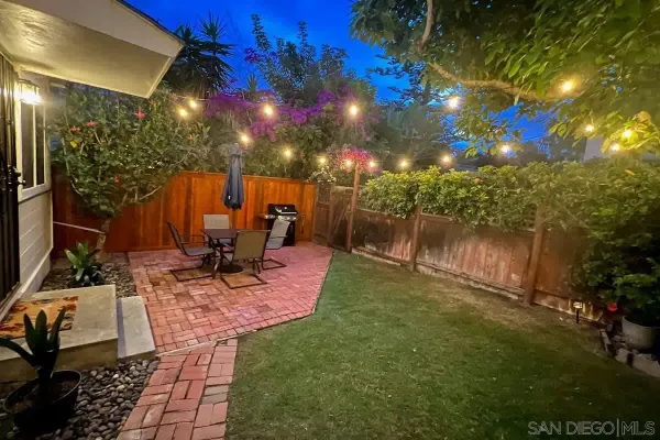 a view of a chair and tables in patio