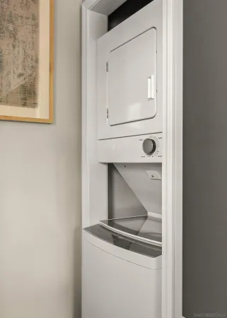 a room with a wooden floor and mirror