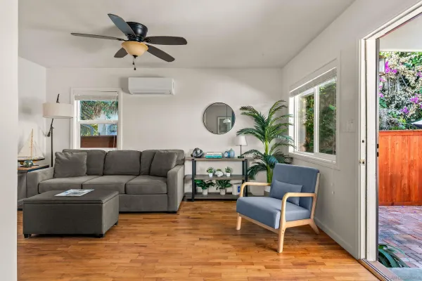 a living room with furniture and a large window