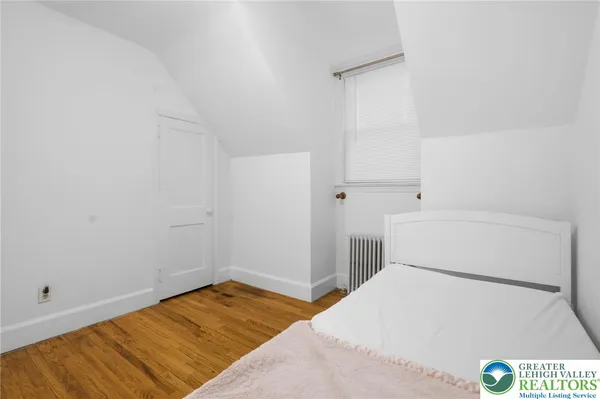 a room with a bed and utility room