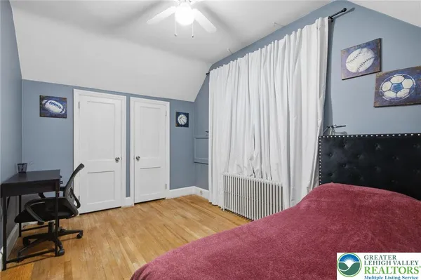 a room with furniture and pool table