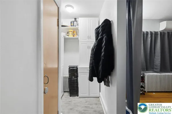 a utility room with dryer washer and other items