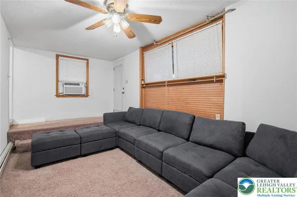 a living room with furniture and a window