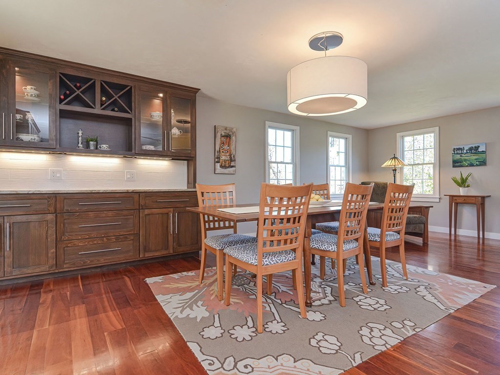 89 McClellan Road Sutton, MA 01590 - Photo 12 of 42 a dining room with furniture and wooden floor