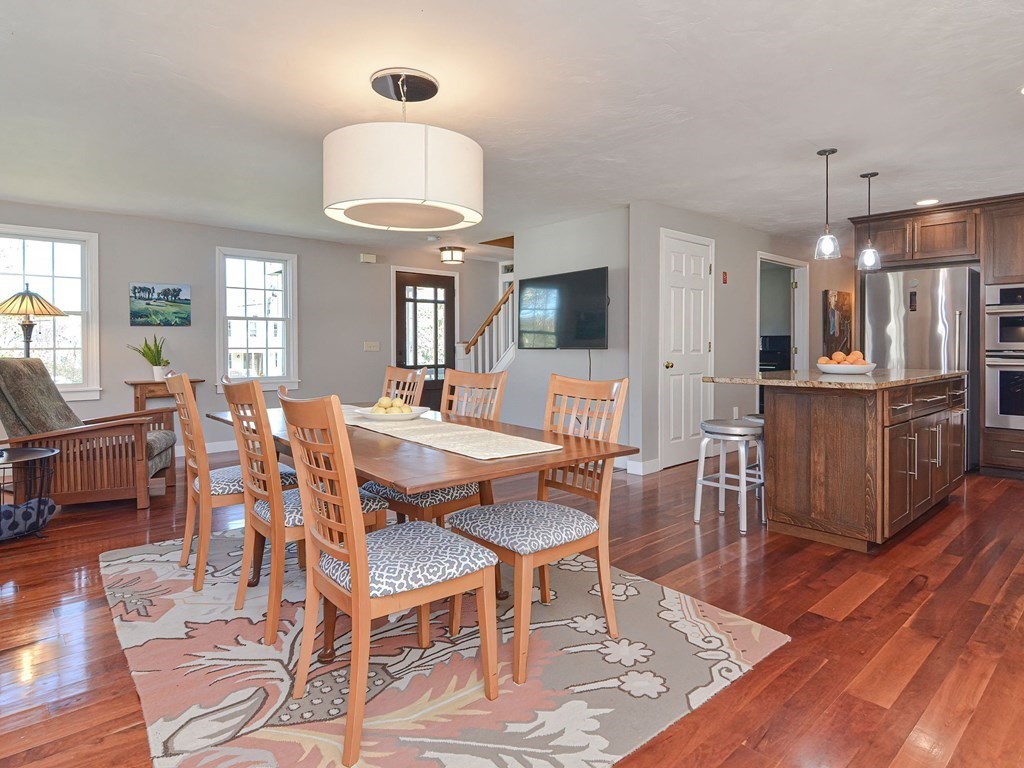 89 McClellan Road Sutton, MA 01590 - Photo 14 of 42 a view of a dining room with furniture and wooden floor