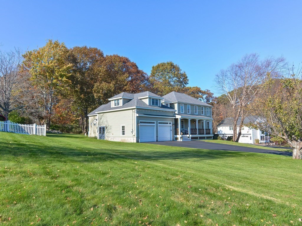 89 McClellan Road Sutton, MA 01590 - Photo 2 of 42 a view of a house with a big yard
