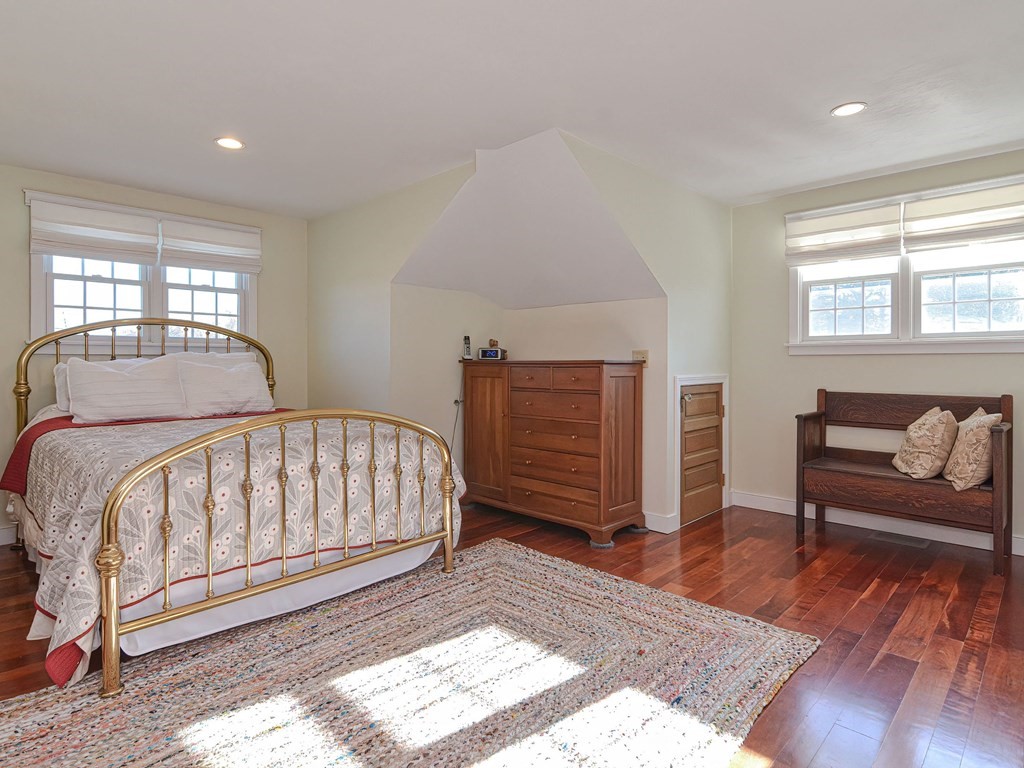 89 McClellan Road Sutton, MA 01590 - Photo 21 of 42 a bedroom with a bed and wooden floor