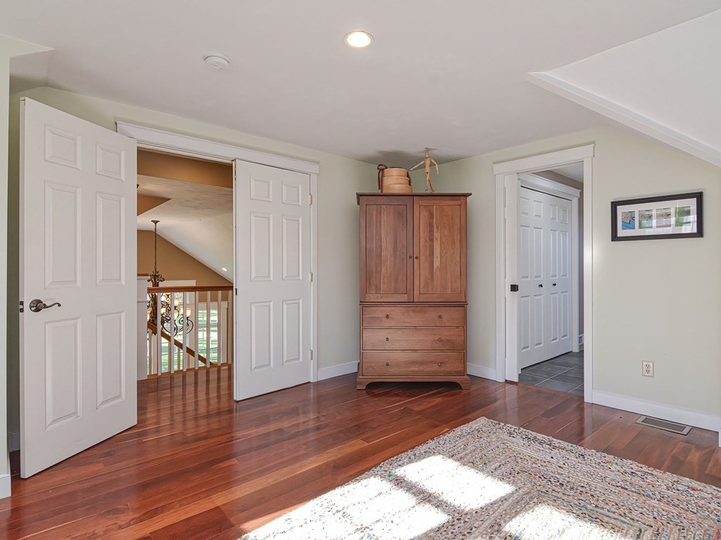 89 McClellan Road Sutton, MA 01590 - Photo 23 of 42 an empty room with wooden floor and closet