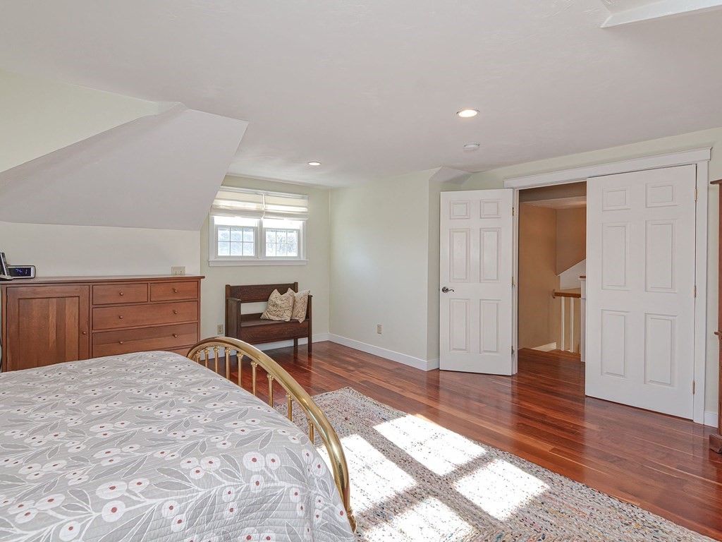 89 McClellan Road Sutton, MA 01590 - Photo 24 of 42 a bedroom with a bed and a dresser