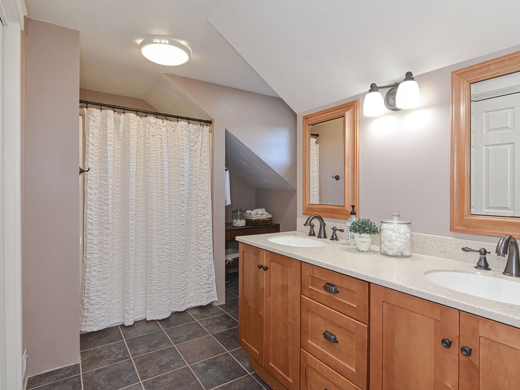 89 McClellan Road Sutton, MA 01590 - Photo 25 of 42 a spacious bathroom with a double vanity sink a mirror and a shower