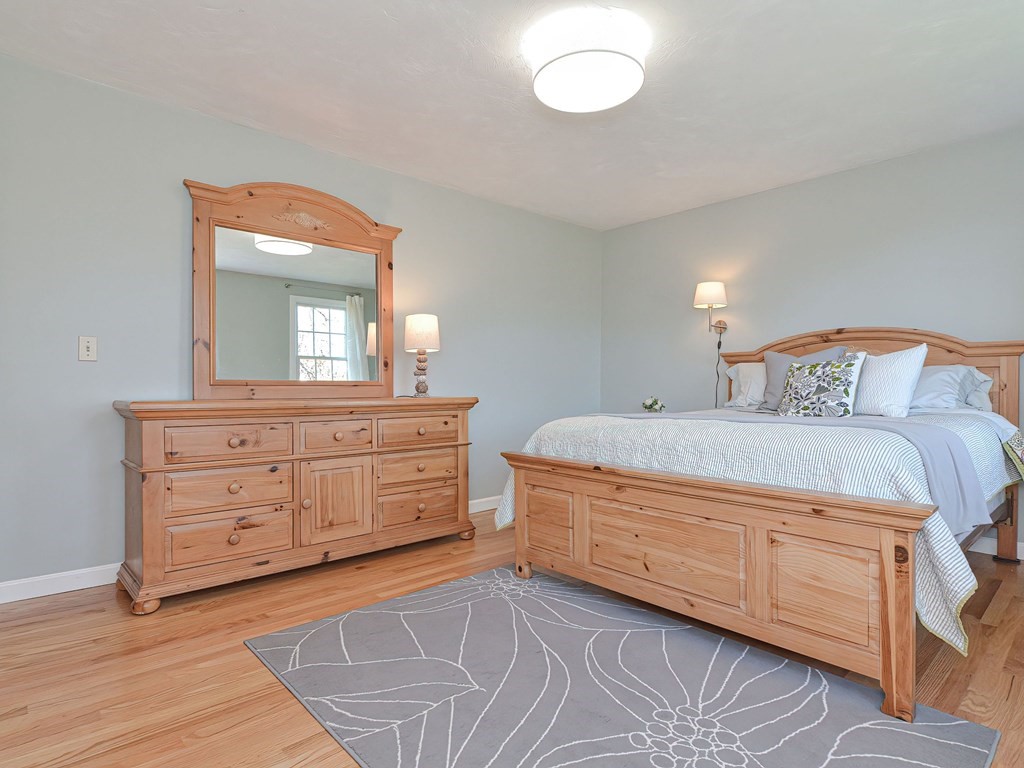 89 McClellan Road Sutton, MA 01590 - Photo 27 of 42 a bedroom with a bed and a dresser