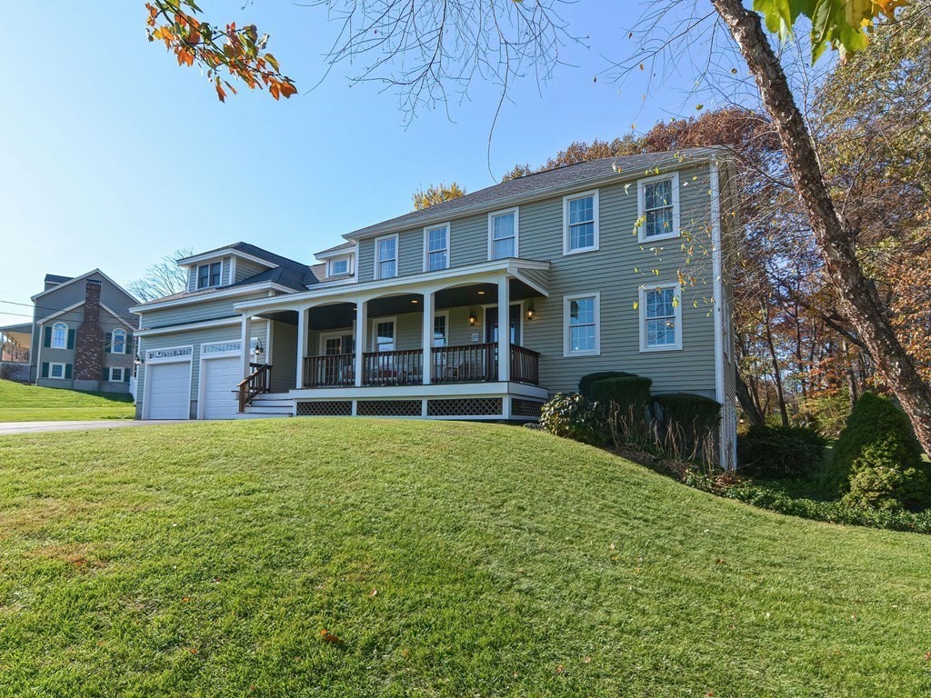 89 McClellan Road Sutton, MA 01590 - Photo 3 of 42 a house view with a garden space