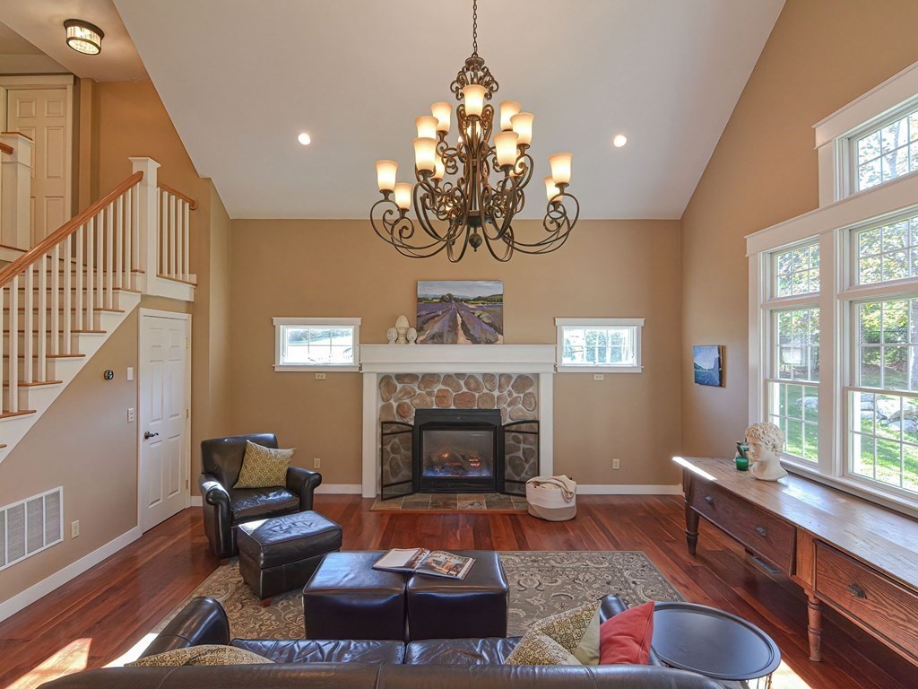 89 McClellan Road Sutton, MA 01590 - Photo 6 of 42 a living room with furniture and a fireplace