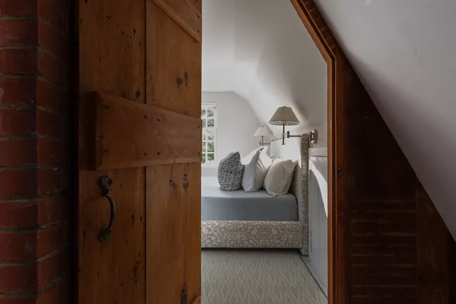 a bedroom with bed and a window