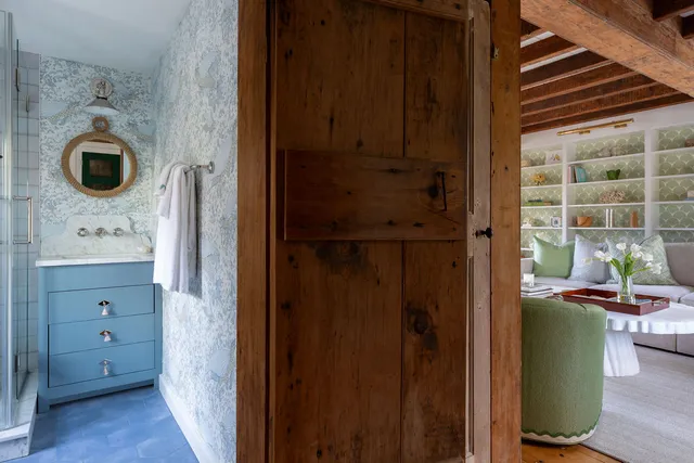 a bathroom with a shower and a mirror
