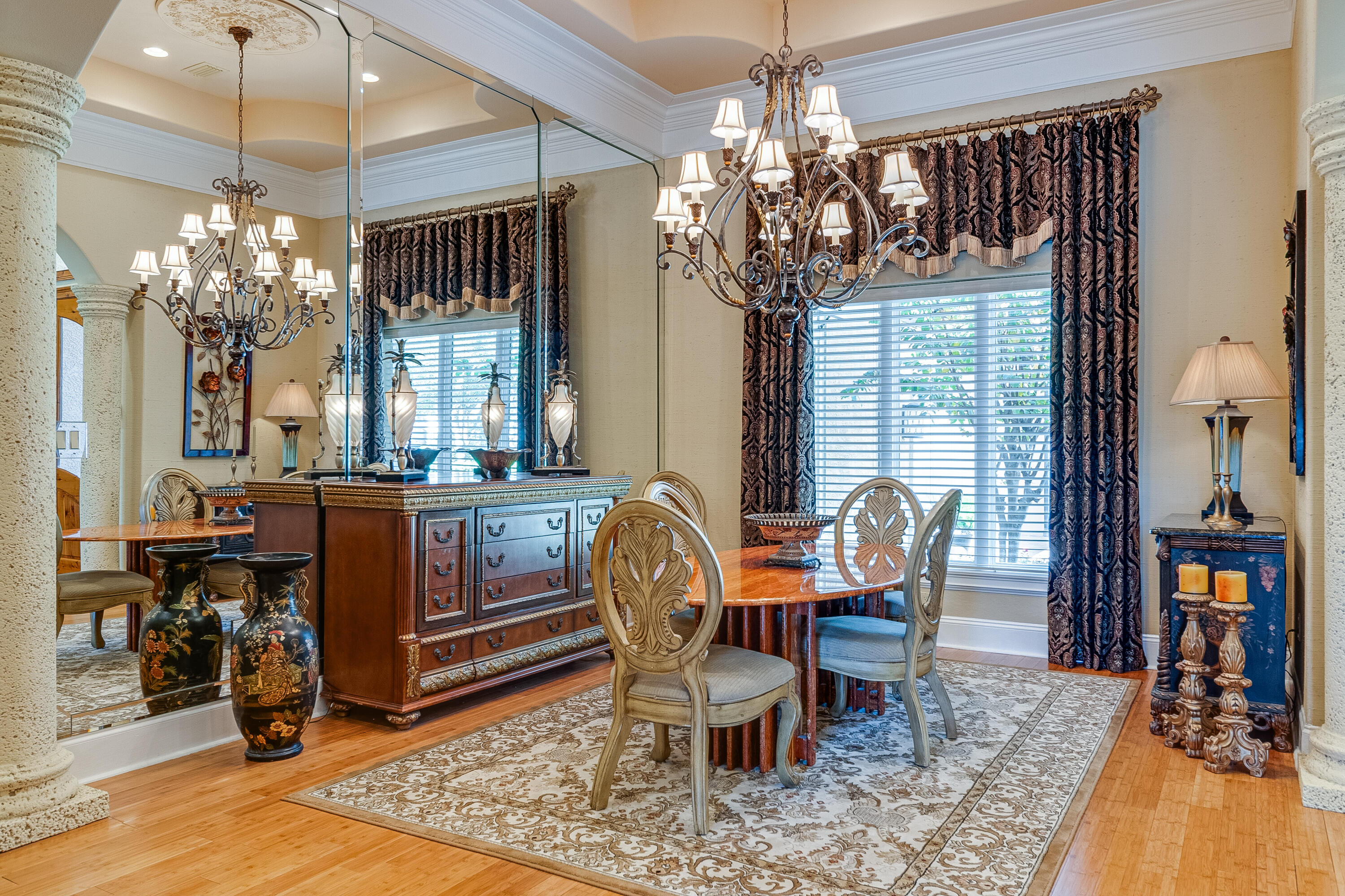 473 Captains Circle Destin, FL 32541 - Photo 14 of 64 a view of a dining room with furniture a chandelier and wooden floor