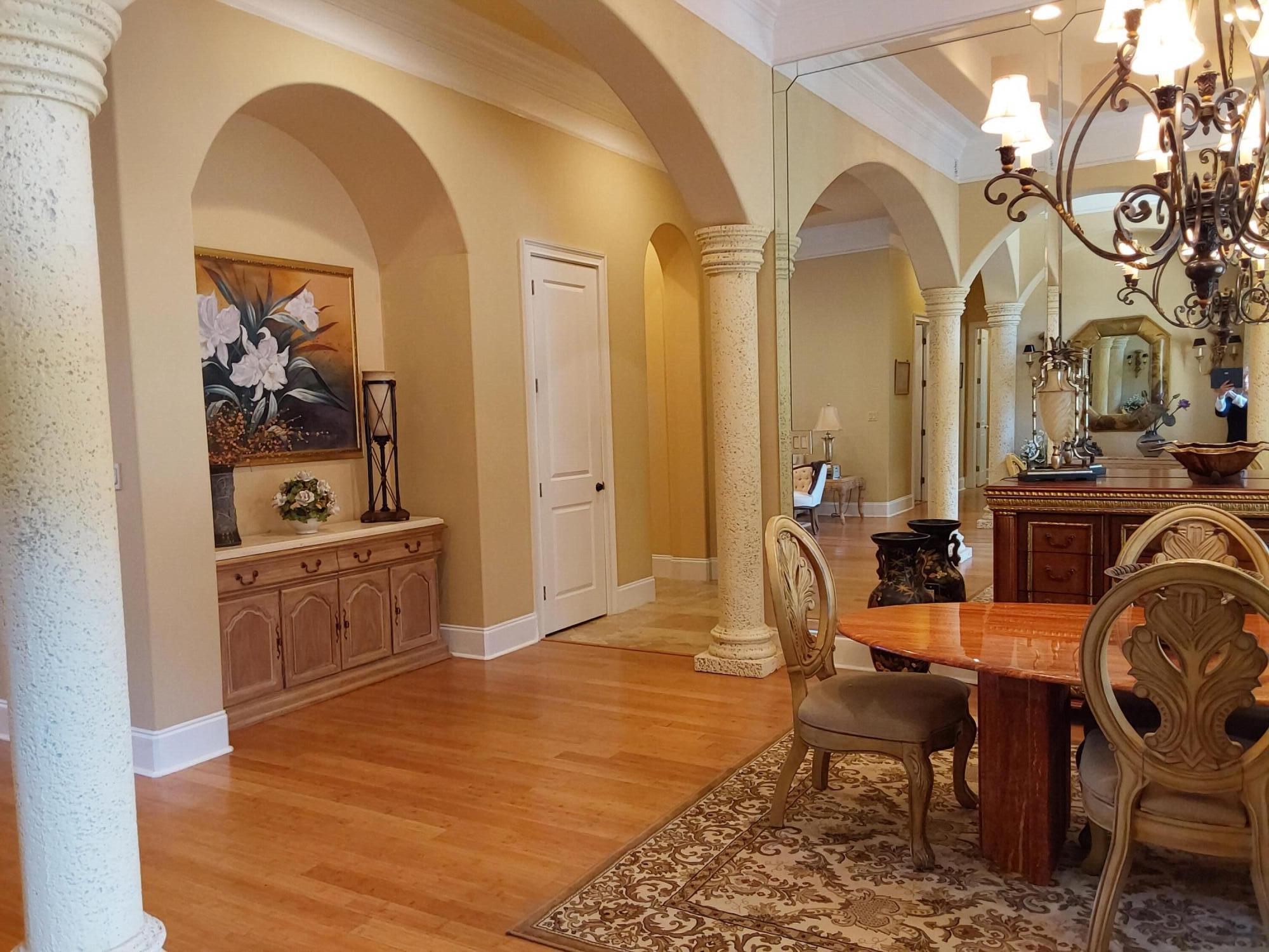 473 Captains Circle Destin, FL 32541 - Photo 15 of 64 a view of a dining room with furniture and wooden floor