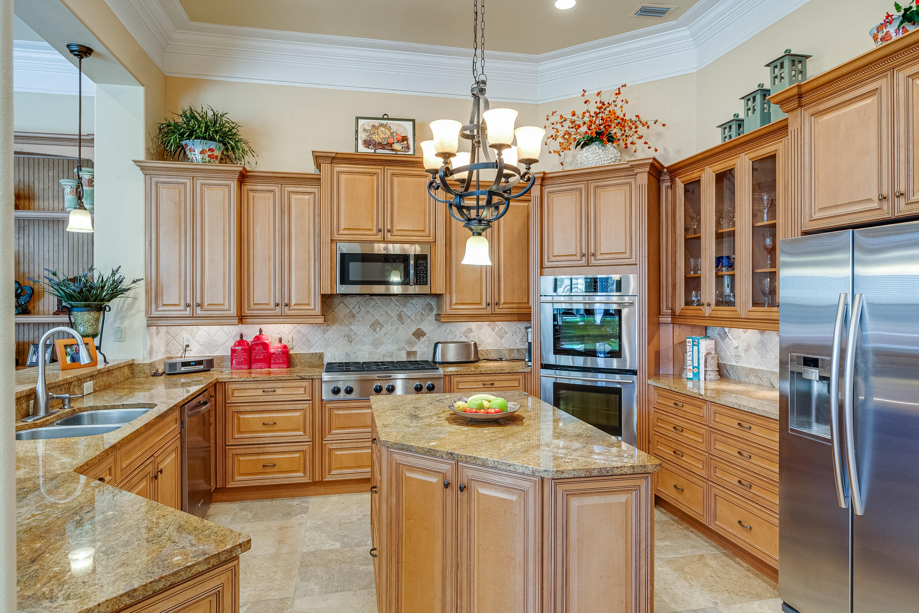 473 Captains Circle Destin, FL 32541 - Photo 25 of 64 a kitchen with stainless steel appliances granite countertop a sink stove and refrigerator