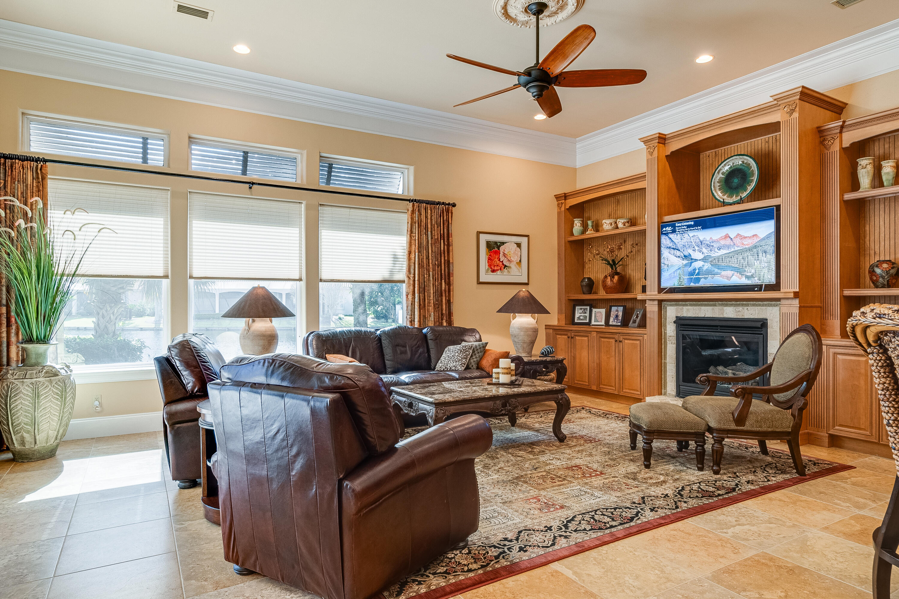 473 Captains Circle Destin, FL 32541 - Photo 30 of 64 a living room with furniture a fireplace and a flat screen tv