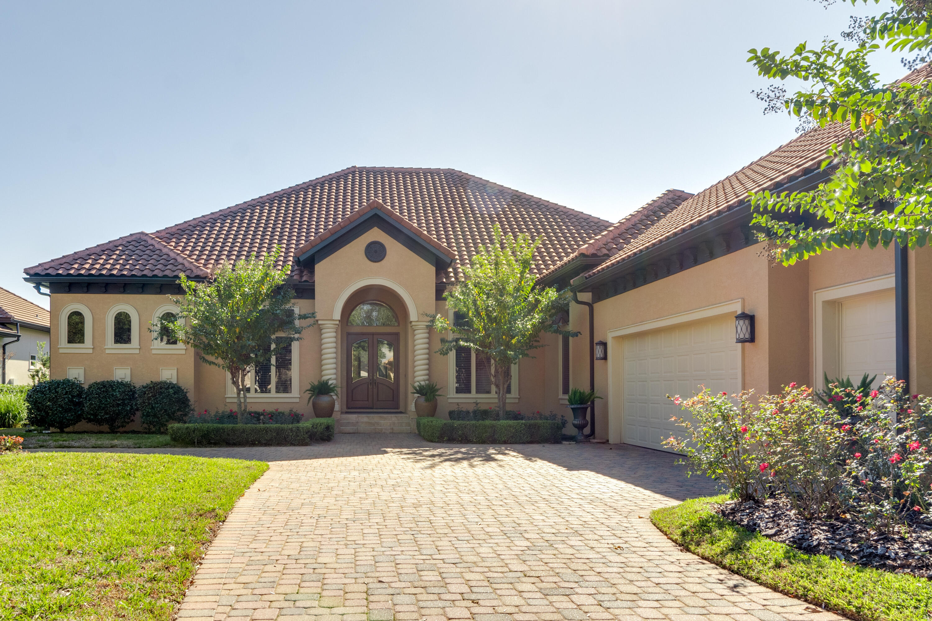 473 Captains Circle Destin, FL 32541 - Photo 3 of 64 a front view of a house with a garden
