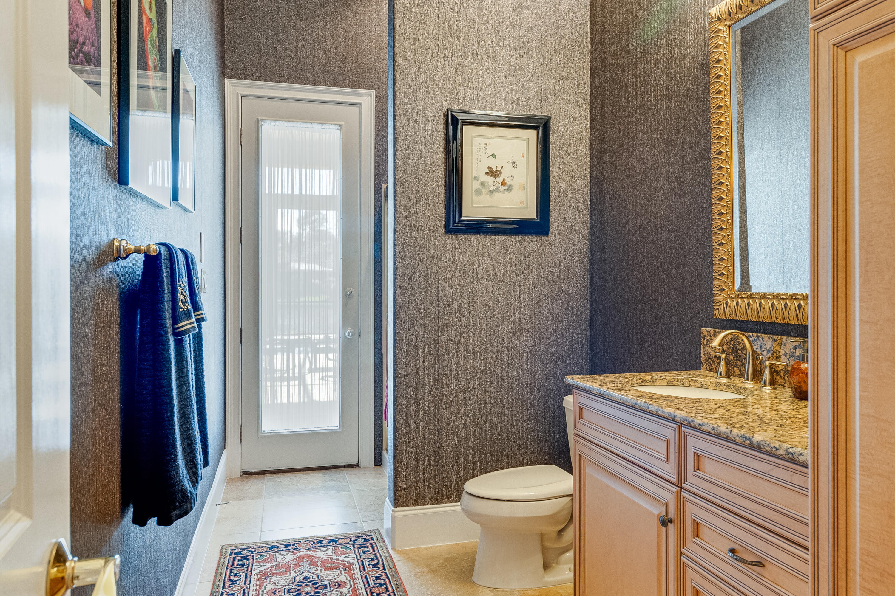 473 Captains Circle Destin, FL 32541 - Photo 36 of 64 a bathroom with a granite countertop toilet and a sink