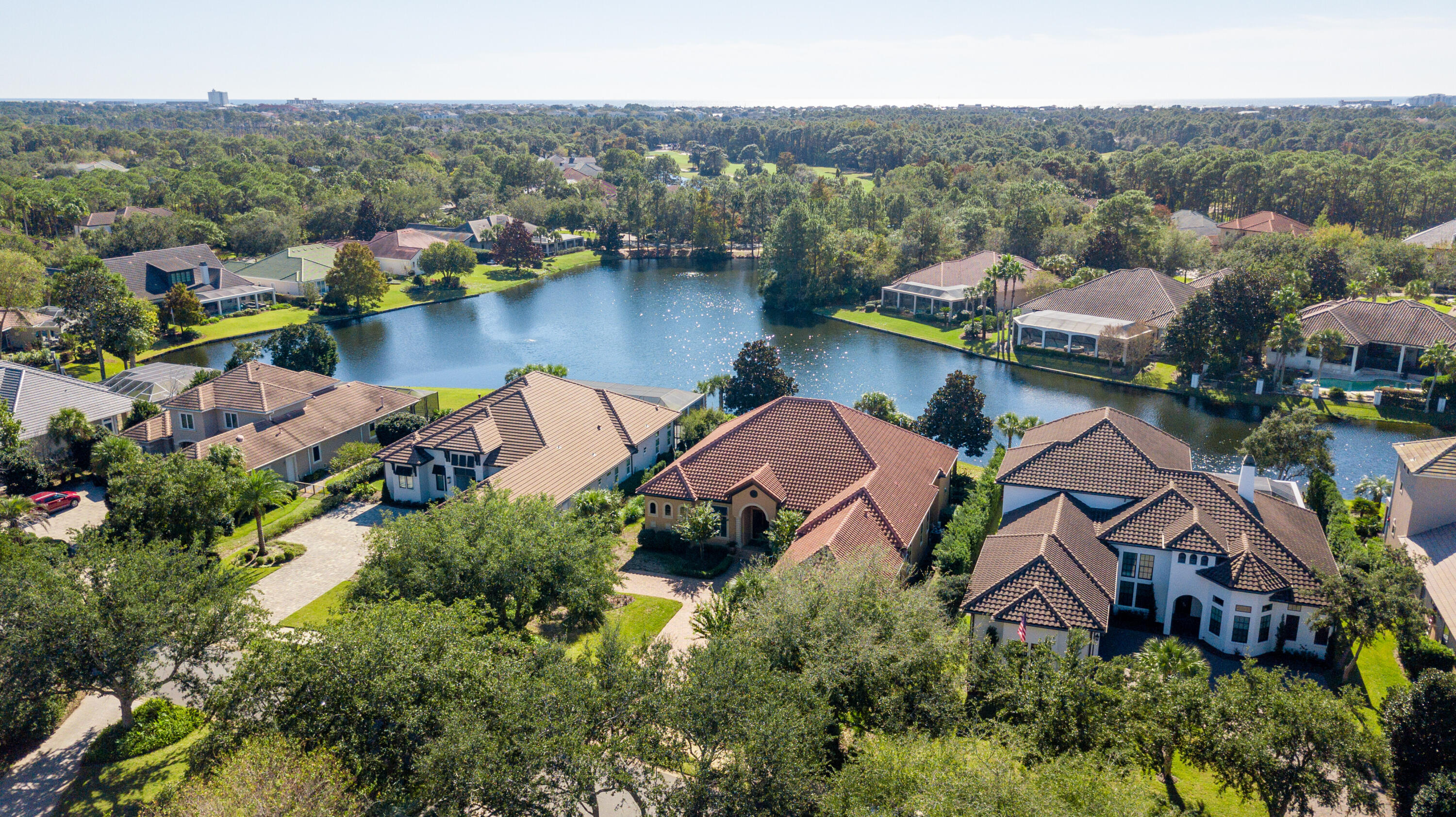 473 Captains Circle Destin, FL 32541 - Photo 43 of 64 an aerial view of house with yard swimming pool and lake view