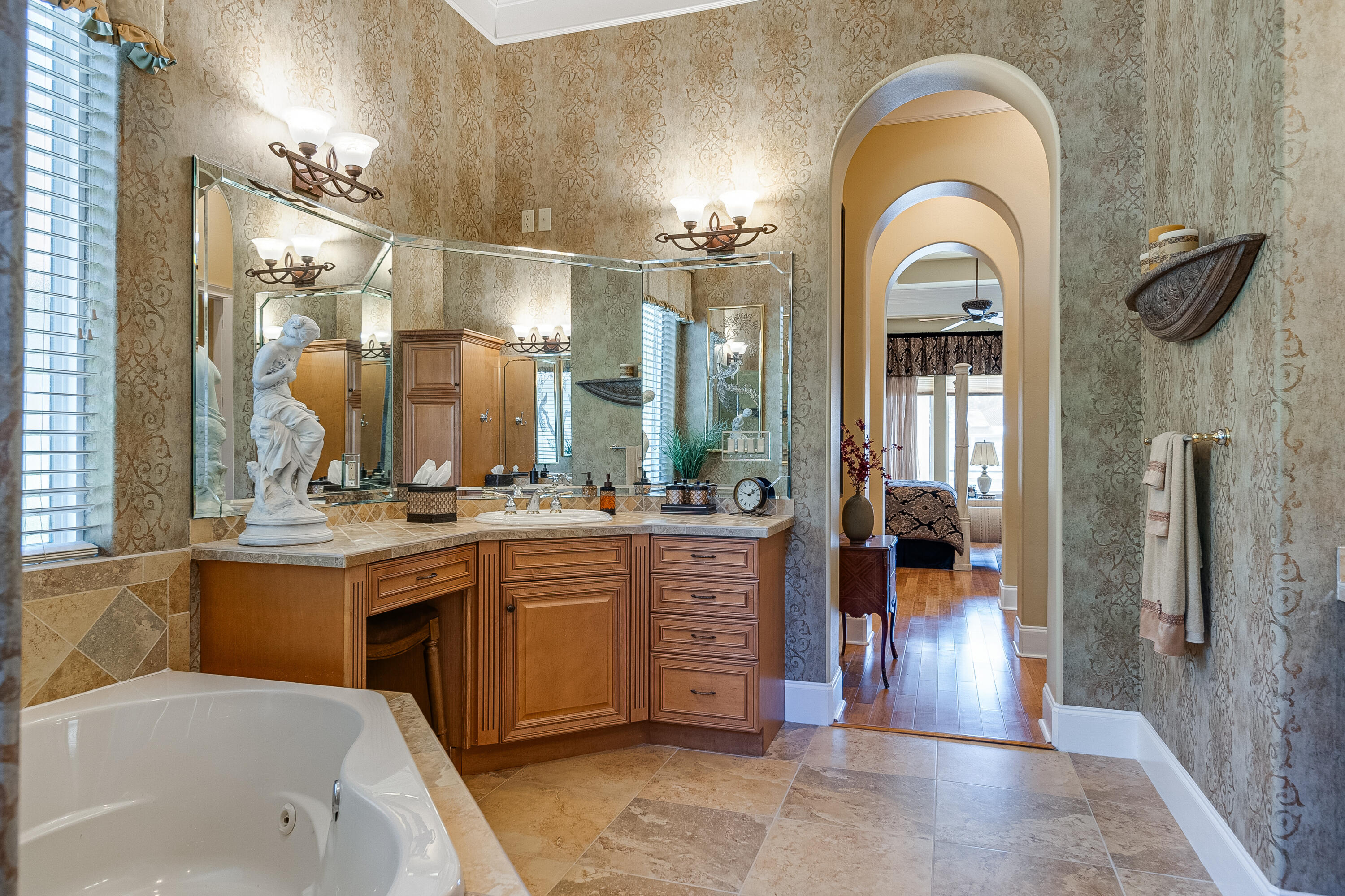 473 Captains Circle Destin, FL 32541 - Photo 54 of 64 a en suite bathroom with a granite countertop sink a mirror and shower