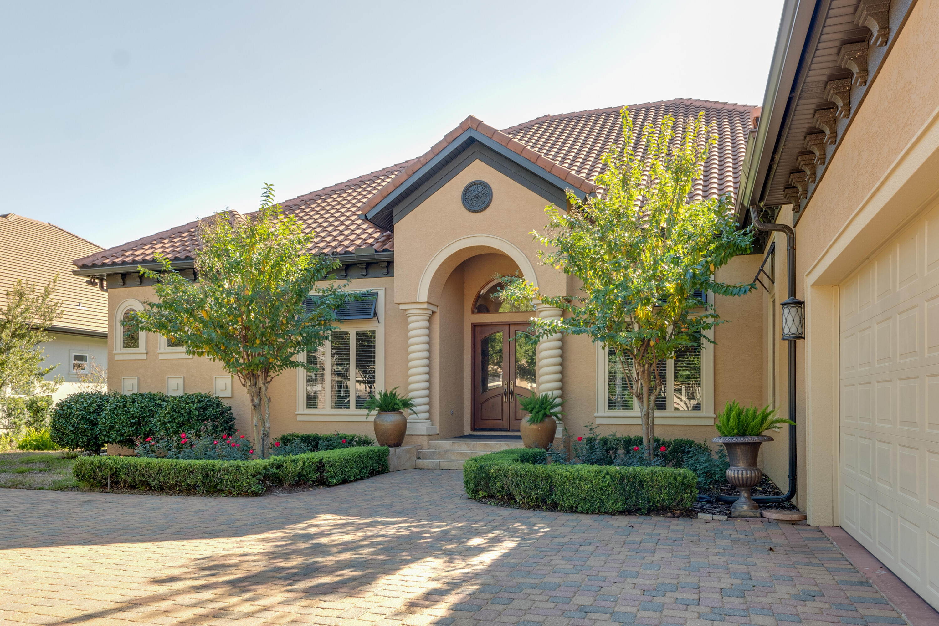 473 Captains Circle Destin, FL 32541 - Photo 7 of 64 a front view of a house with garden