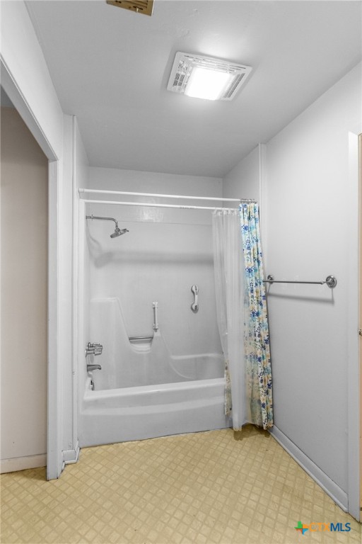 614 Sarah Street Edna, TX 77957 - Photo 17 of 19 a bathroom with a bathtub and a shower