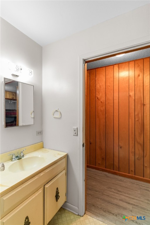 614 Sarah Street Edna, TX 77957 - Photo 18 of 19 a bathroom with a sink and a mirror