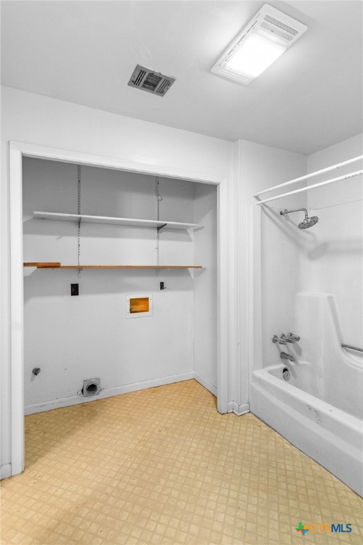 614 Sarah Street Edna, TX 77957 - Photo 19 of 19 a view of walk in closet with empty racks