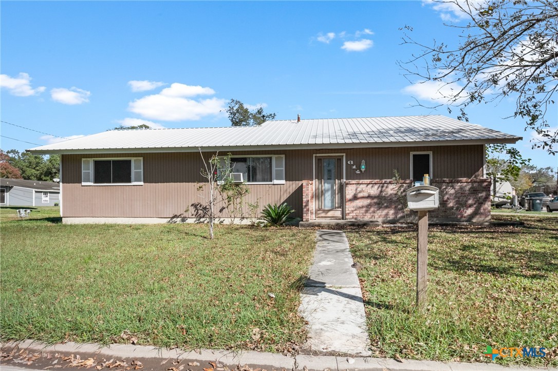 614 Sarah Street Edna, TX 77957 - Photo 2 of 19 a front view of house with yard and furniture